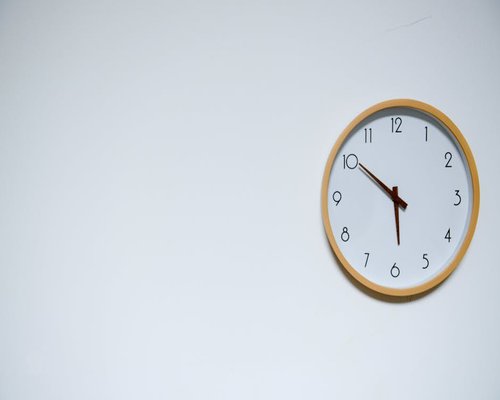 A clock on a wall indicating the passage of time